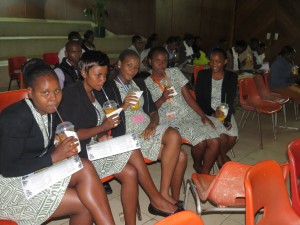 A section of the participants pose for a photo while enjoying a cup of fresh organic juice
